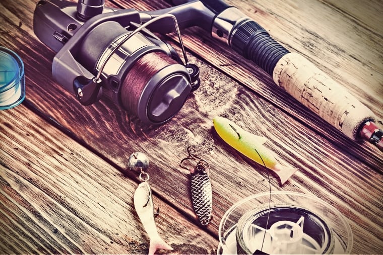 fishing rod and three fish shaped baits