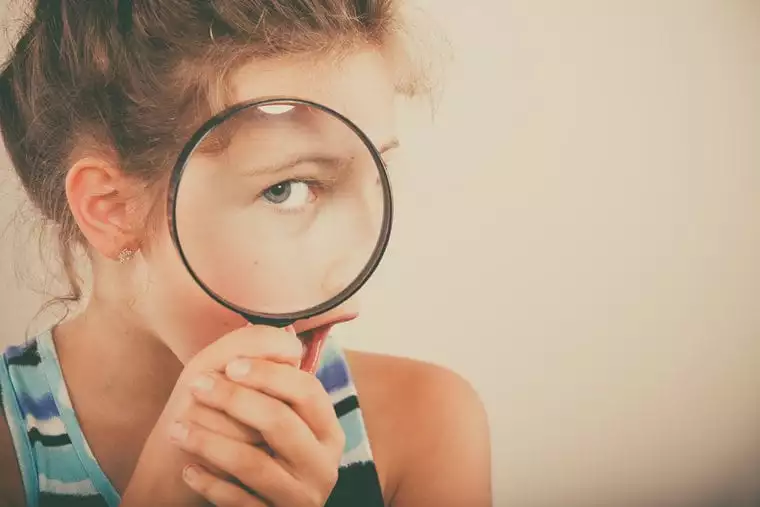 Girl with magnifying glass