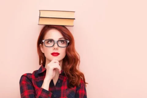 graduate-with-books-on-head